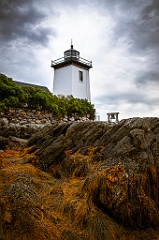 Grindle Point Light Tower Over Cloudy Skies at Low Tide